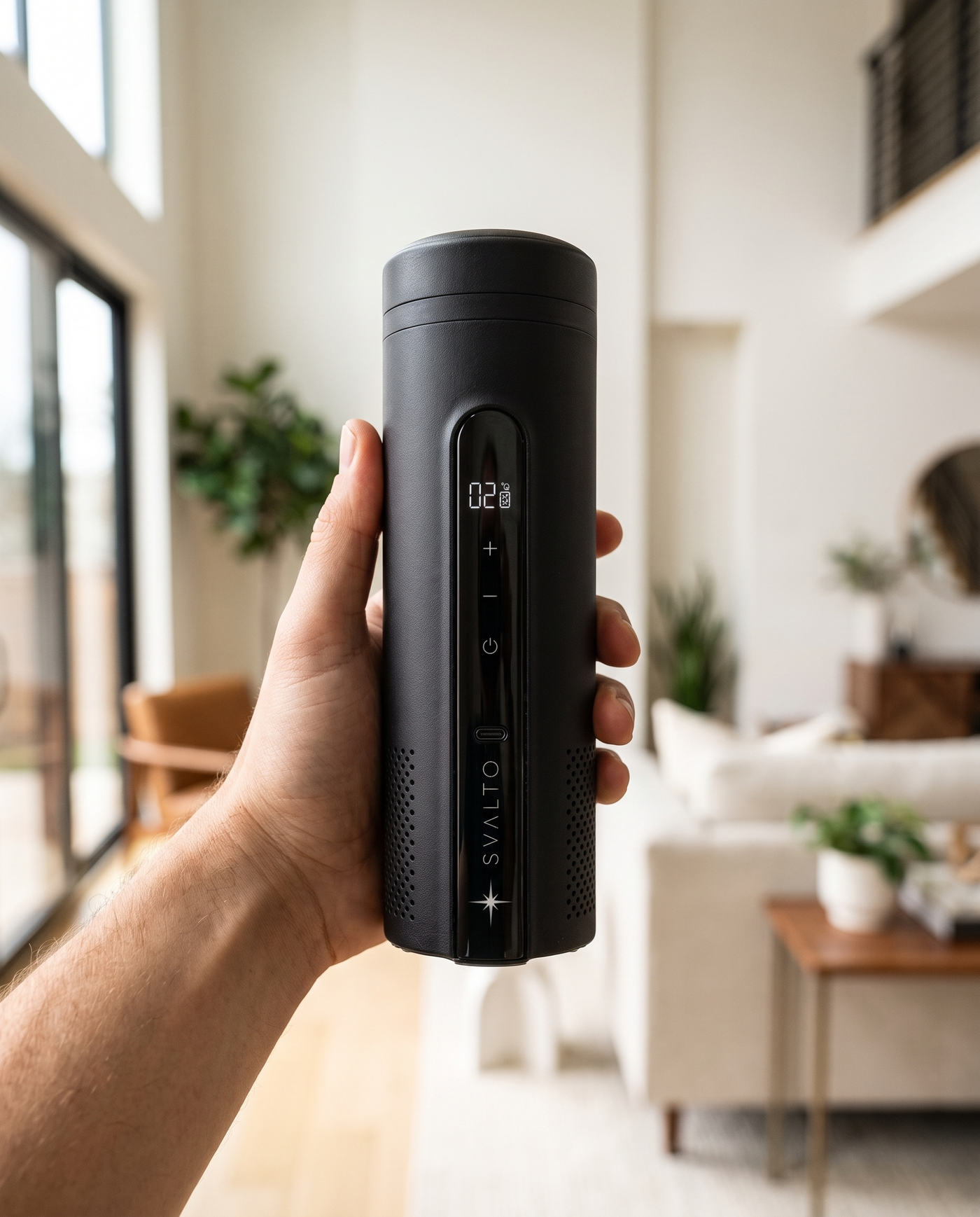 Onyx Black Svalto Cooler Pro — held in hand for scale