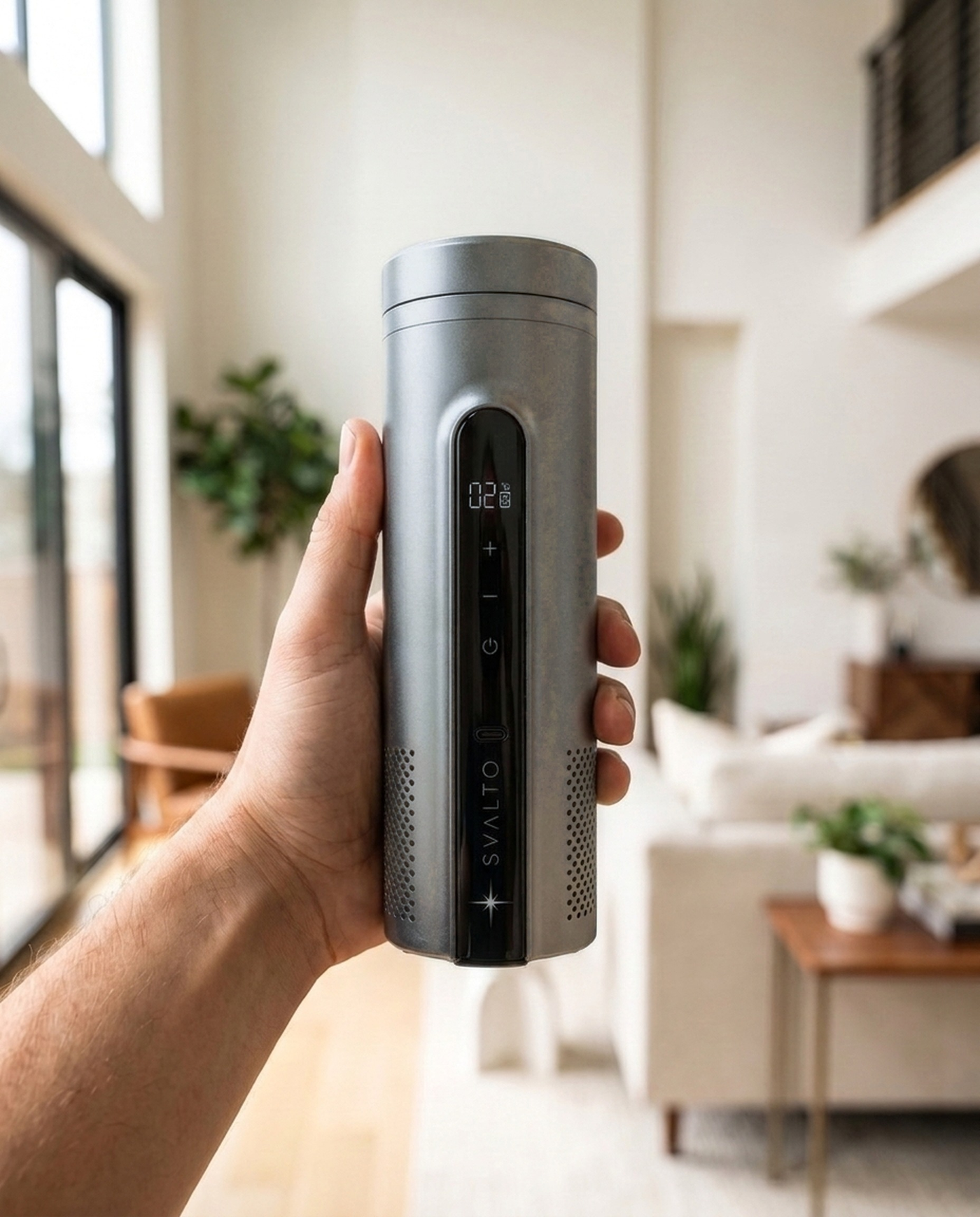 Titanium Svalto Cooler Pro — held in hand for scale