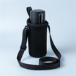 Svalto Travel Bag crossbody cooler sleeve holding the Cooler Pro — studio