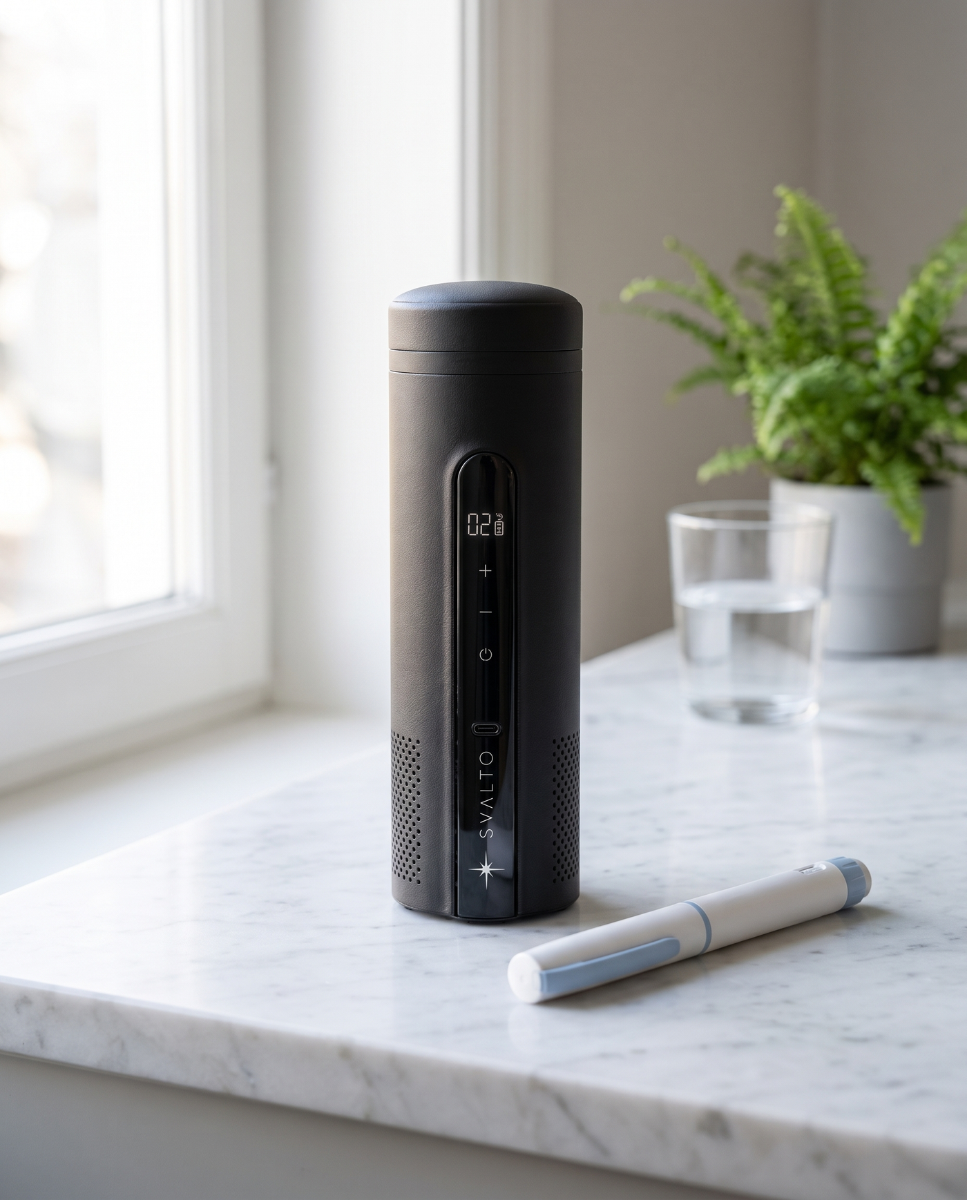 Onyx Black Svalto Cooler Pro — on a kitchen counter beside an insulin pen