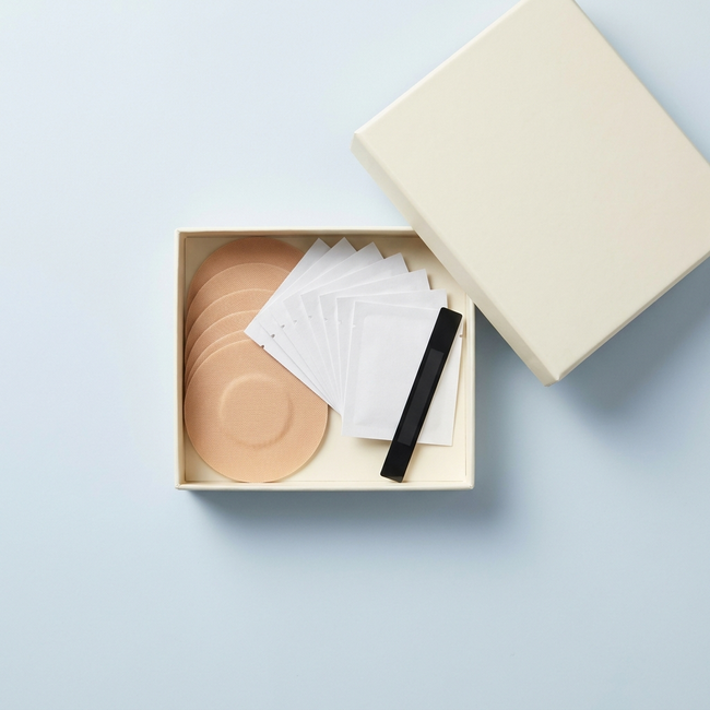 Svalto Refill Club box — open flat-lay with CGM patches, prep pads and temperature strip