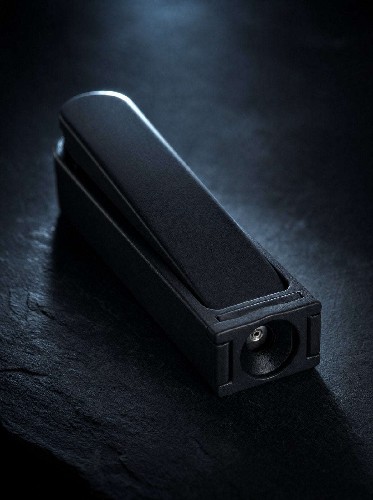 Svalto Sharps Guard lit from one side on a dark surface
