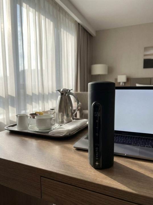 Svalto Cooler Pro on a hotel desk beside the kettle tray, customer photo