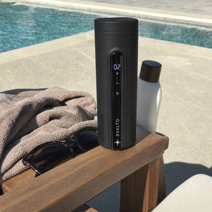 Svalto Cooler Pro on a poolside lounger beside a towel and sunglasses, customer photo