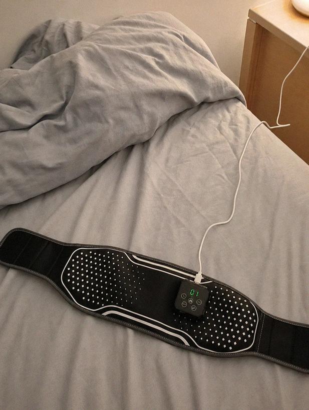 Customer photo: Transit Belt charging on the bed